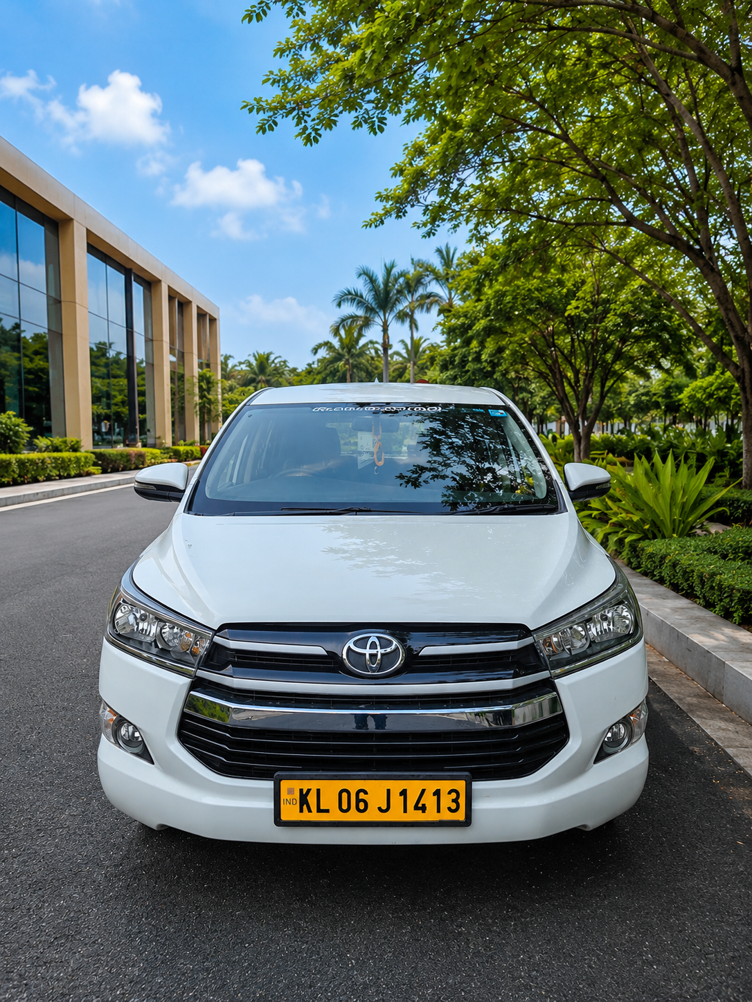 White Toyota Innova corporate rental vehicle