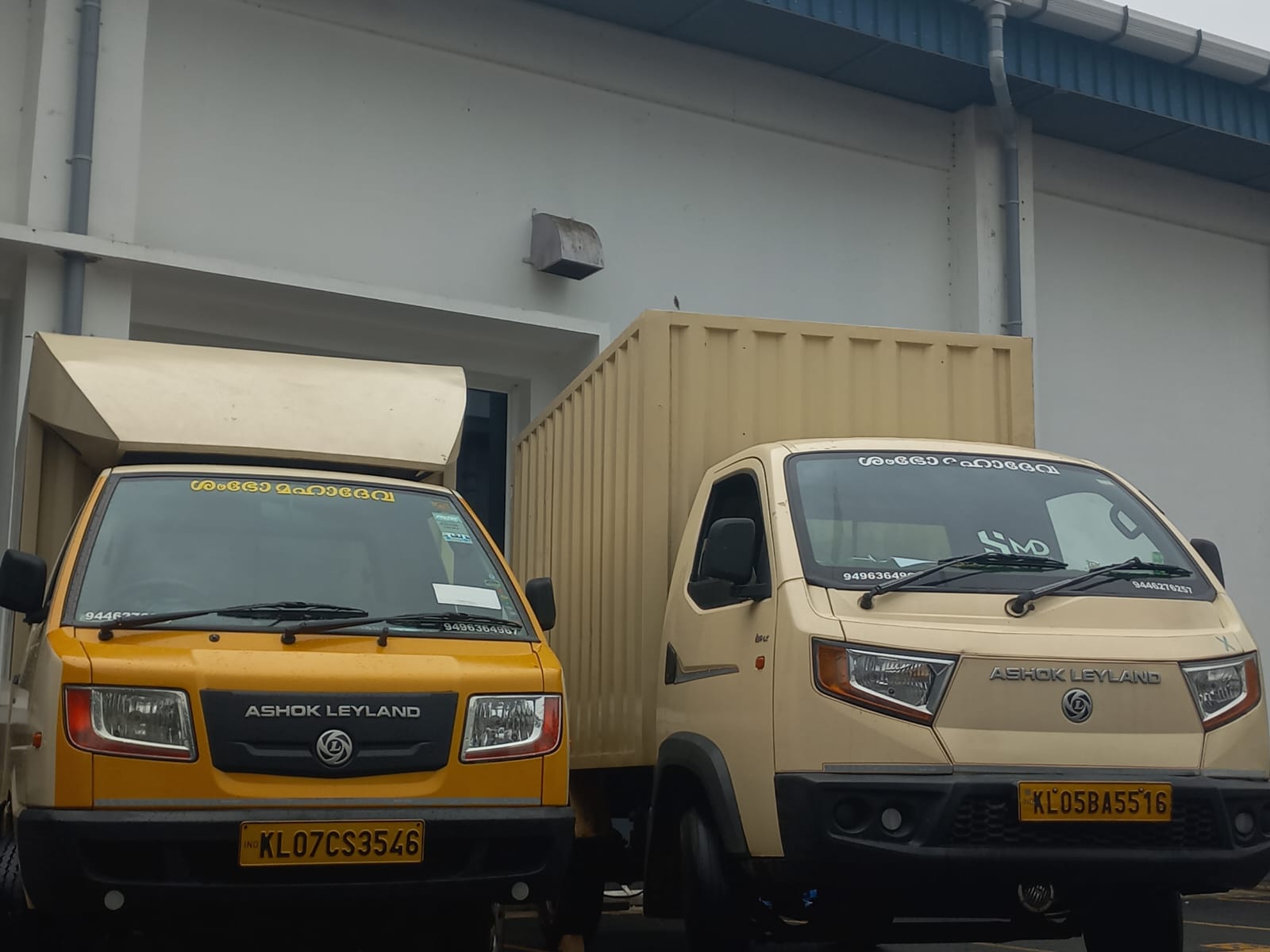 Two SMD light commercial cargo vehicles at a client facility