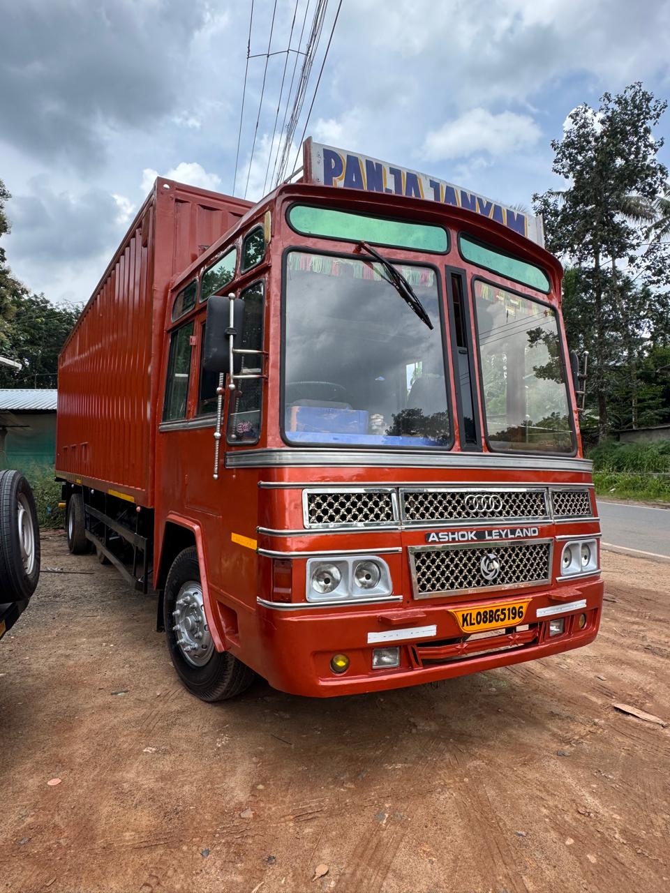Red Ashok Leyland cargo truck